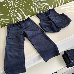 Two pairs of navy pants with matching vest.